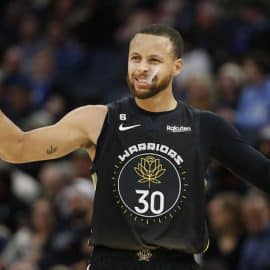 Golden State Warriors guard Stephen Curry calms the crowd down.