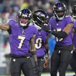 Baltimore Ravens quarterback Lamar Jackson (8) celebrates with wide receiver Rashod Bateman (7)