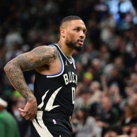 Damian Lillard holds his hands on his side.