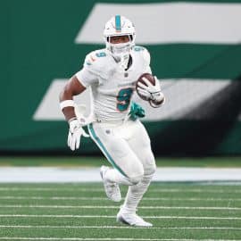 Miami Dolphins tight end Jonnu Smith runs the ball.