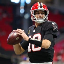 Kirk Cousins holds the ball and prepares to throw.