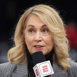 Doris Burke holds up an ESPN microphone.